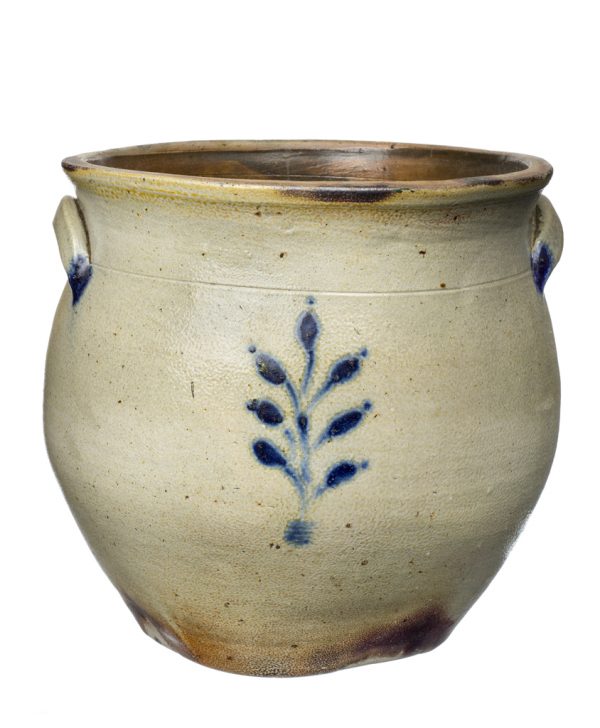 Oatmeal colored crock with a handpainted cobalt blue abstract leaf design.