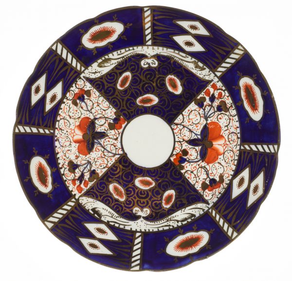A plate divided into four sections at center with eight cartouches around the edge in blue, orange and gold on white.