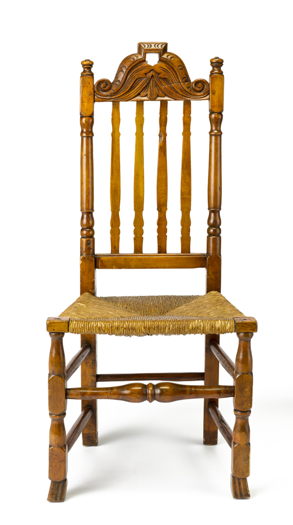 A banister side chair with carved and pierced crest rail, carved 