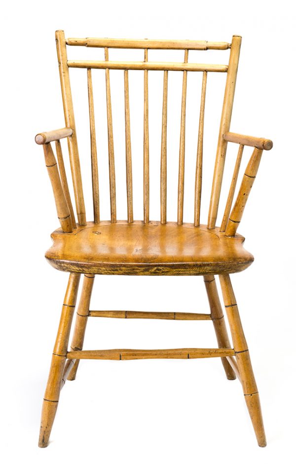 Chair with arms, legs, and stretchers carved to resemble bamboo. Mixed hardwoods. All joins are wood and adhesive; there are no nails.