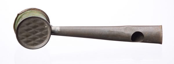 A small metal rattle with a handle that doubles as a whistle.