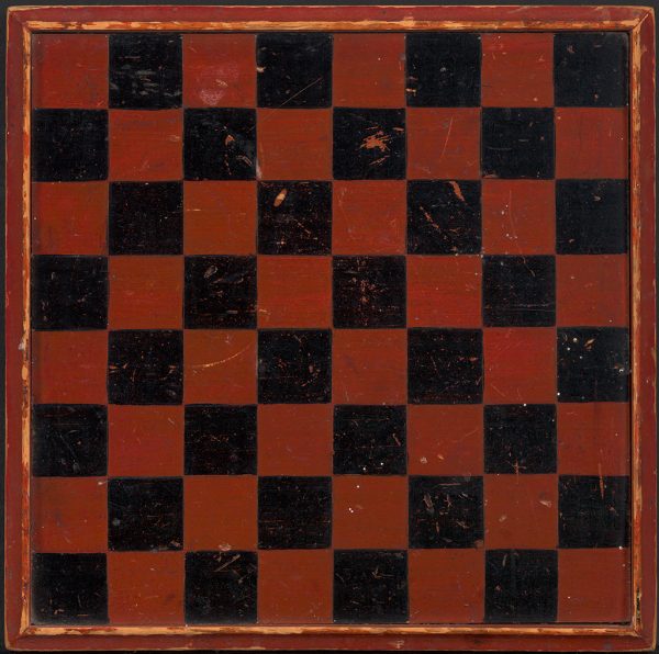 A red and black checkerboard with raised edges.