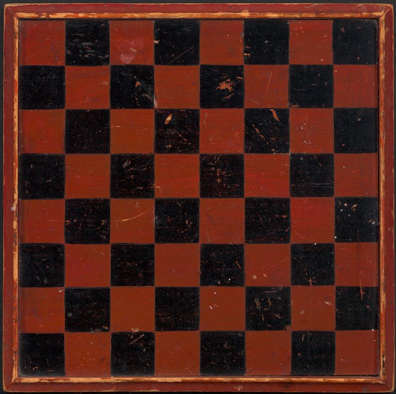 A red and black checkerboard with raised edges.