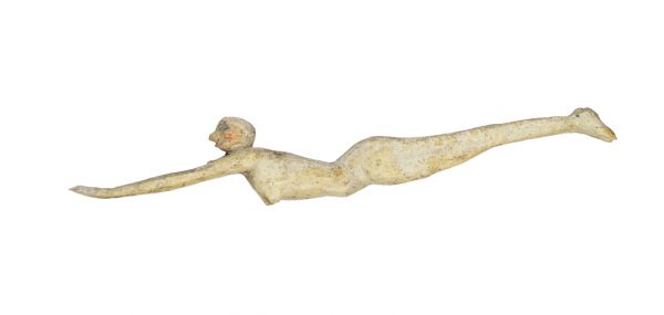 Profile of a female figure with outstretched arms in a dive, in light gray paint.