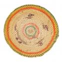 A flat woven plaque that has colorful rows and abstracted design in brown