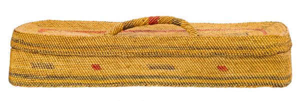 Twinned plant fiber basket with handled lid. Long rectangular shape with straight sides. Wrapped fibers are primarily undyed with areas of red and purple colors creating a pattern.