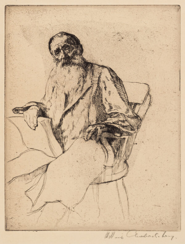 Bearded old man in frame chair leans forward to viewer; left hand and arm resting on chair arm; no more body is seen.