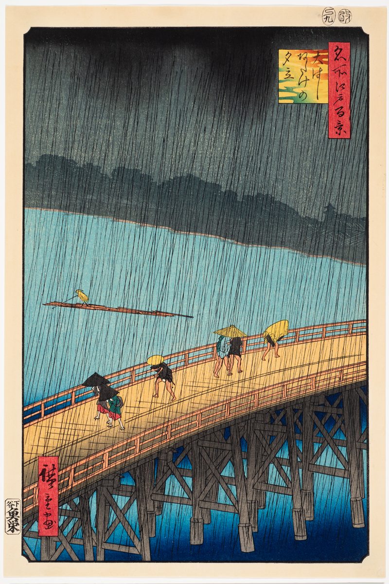 After the 1857 print. The roiling black clouds burst into sheets of heavy rain, scattering the huddled shapes on the bridge below. On the blue-gray expanse of the Sumida River, a solitary boatman poles his log raft downstream past the area known as Atake, impervious to the storm. This is a y?dachi—an 