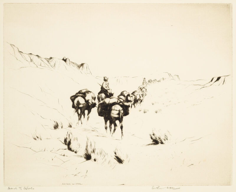 A trail of horses and men leading them. There are mountains in the background of the trail scene.