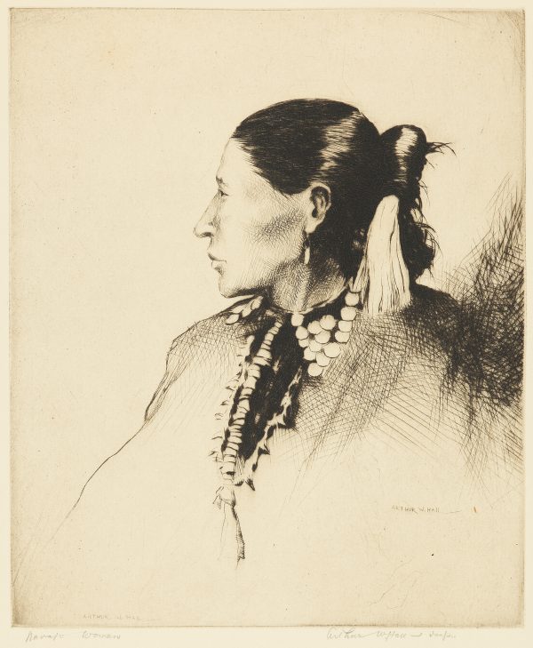 Navajo woman in profile with native jewelry and embellishments on.