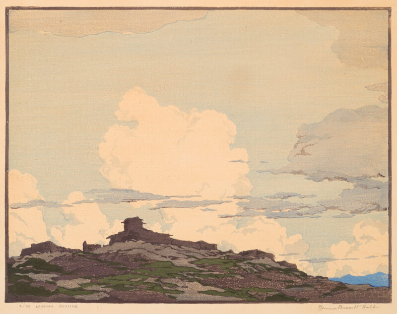 Many buildings in silhouette are on top of a hill. The sky is 3/4th of the image and has white puffy clouds as well as darker ones. A blue mountaing is in the lower right.