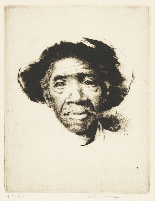 Old African American man with a hat on close up of just face.