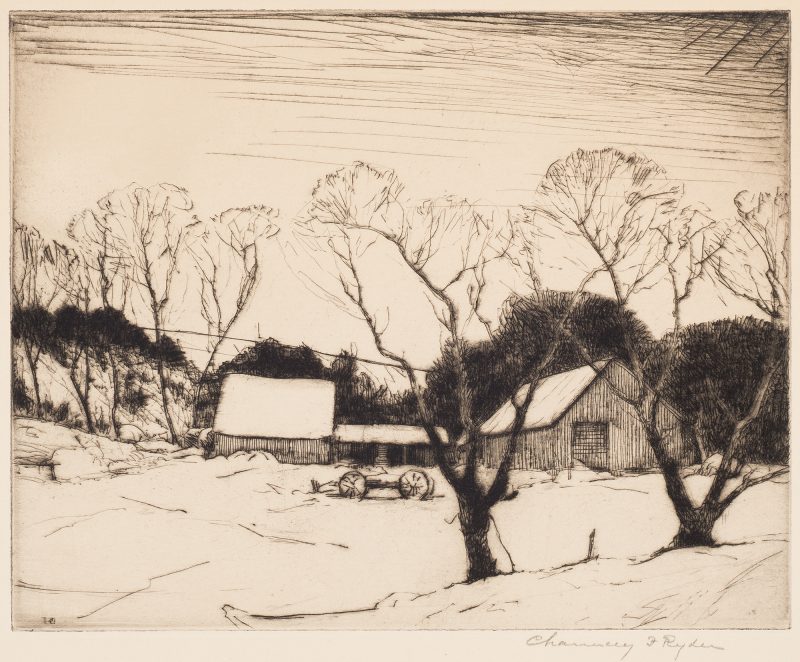 A snowy barn is pictured in a snowy yard with barren trees and a small wagon.