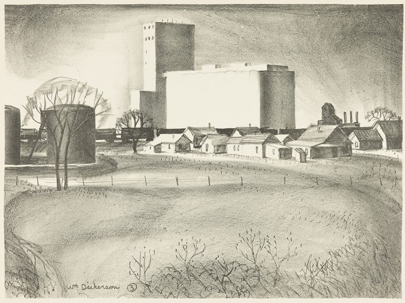 An empty field in the foreground lead to a wire fence and small town with a grain elevator in the background.