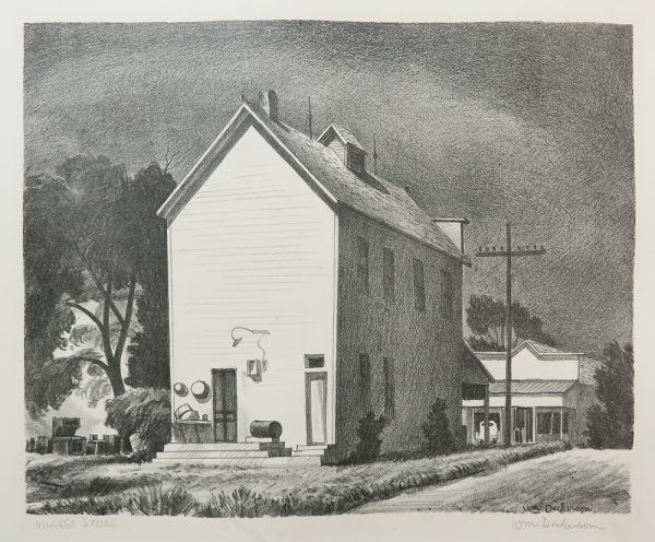 A two-storey building has no windows on the side facing the viewer. There is a road and telephone pole to the right with another smaller building behind on the right.