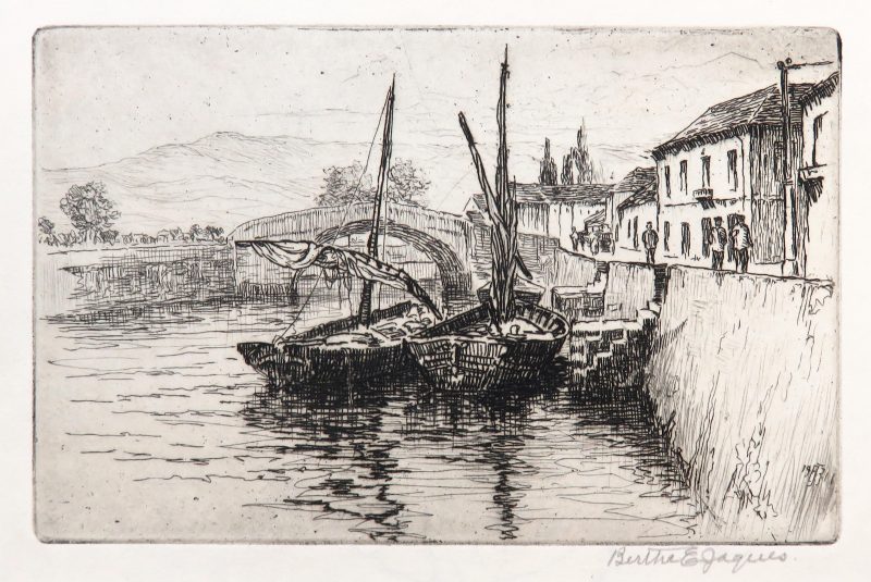 Two sail boats are docked at a high stone wall. There are steps going to the street level where figures walk in front of houses. An arched bridge is in the distance.