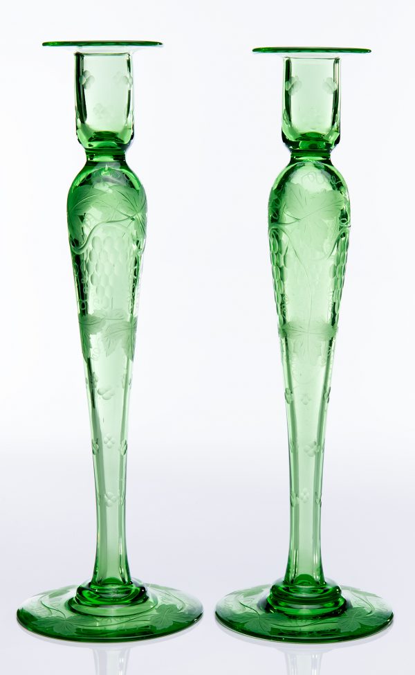 A pair of green candlesticks, engraved