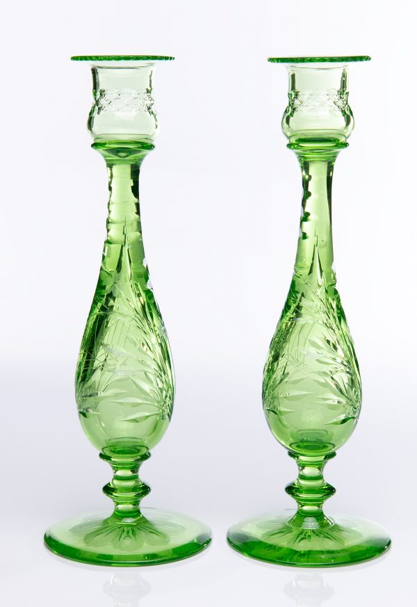 A pair of green candlesticks, engraved in the Butterfly pattern