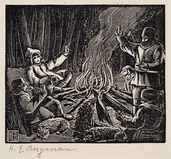 Four men dressed in winter clothes and their dogs huddle around a fire. The men hold their cups up in a toast.