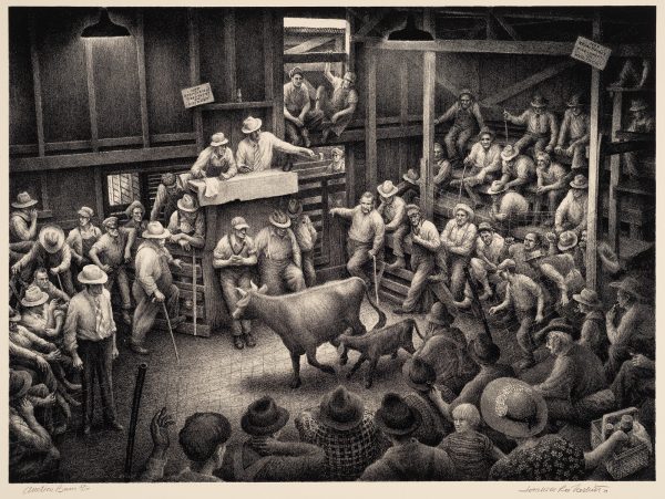 A crowded cattle auction house. The cow has horns and a calf beside her. The auctioneer is pointing to the bidder.