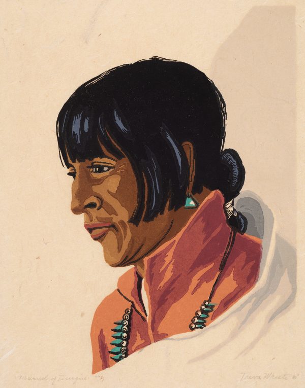 Portrait of a Native American wearing a turquoise earring and necklace.