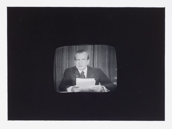 A black background around a 1974 era television, picturing President Nixon as he resigns.