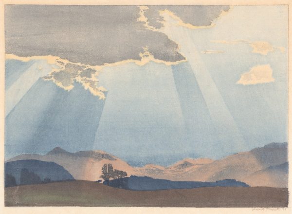 Several beams of sunlight emit from a dark cloud over a blue sky and somewhat empty landscape of blue and brown hills.