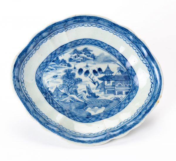 Quatrefoil Vegetable Dish in the Blue Willow pattern, with no decoration on the outside of the bowl.