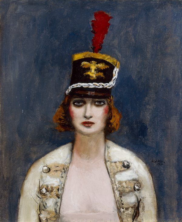 A shako is the military dress hat seen in this portrait of a female circus performer.