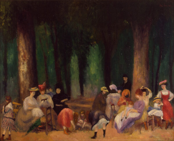 Women gather in a park, standing and sitting in front of a green woods behind them.