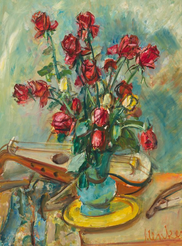 Red roses in a vase stands in front of a musical instrument.