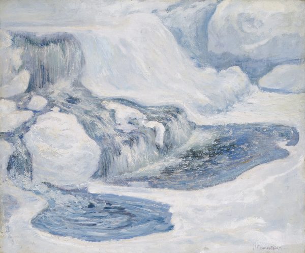 Close-up view of a waterfall in winter. The blue water is surrounded by white ice.