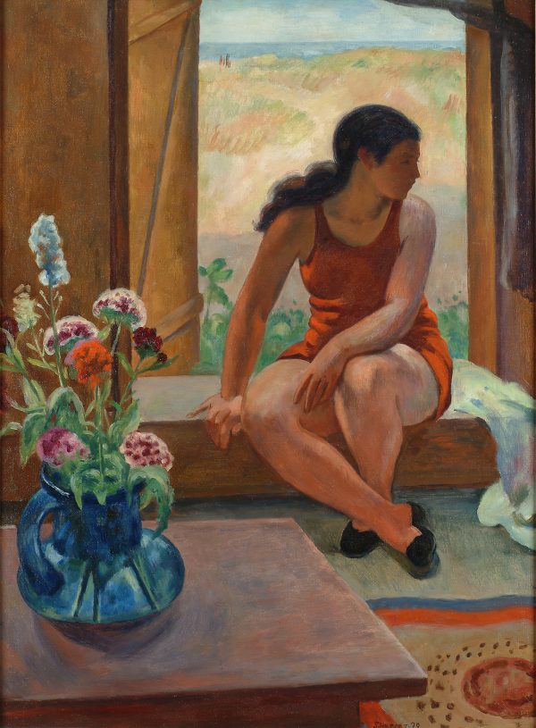 A woman sits before a window facing indoors but looking to her left. There is a blue vase with flowers on the left side.