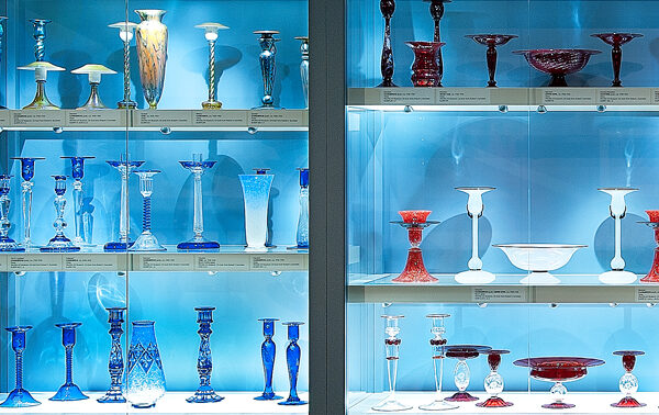Interview view of display case filled with glass works