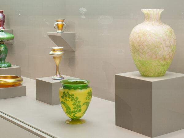 Gallery image of Steuben glass - green and yellow vase in the foreground