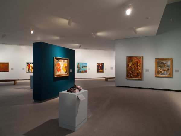 Interior image of the galleries showing paintings on the walls and sculpture on pedestals