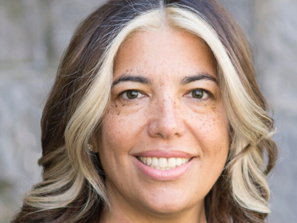 Photo of a woman's face looking at the camera