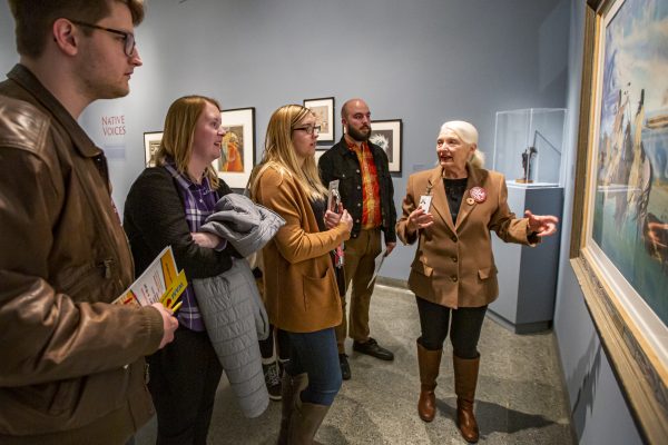 Interior view of a group of teachers and educators looking at art with a WAM docent