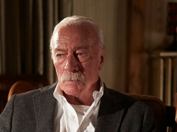 Man Sitting in Chair; Looking Distant