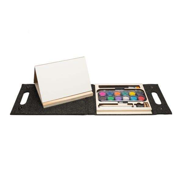 Watercolor kit with 12 paints on the right and a small easel on the left with a black carrying case