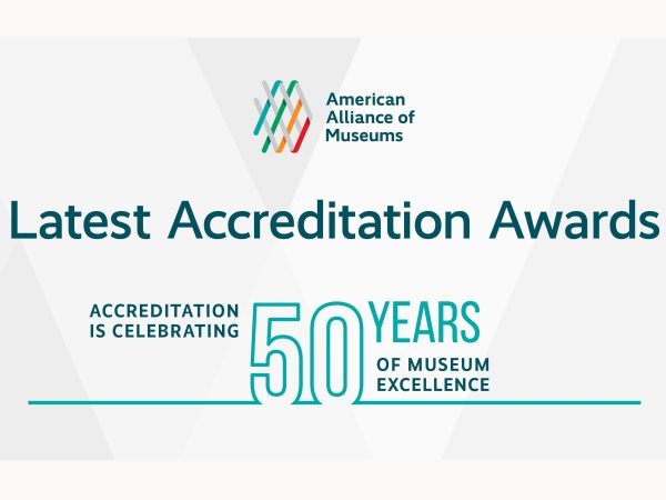 American Alliance of Museums graphic with their multi-color logo and the words in sans-serif teal font Accreditation is Celebrating 50 Years of Museum Excellence