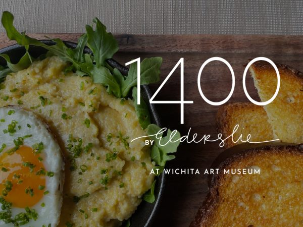 Photo of fried egg and grits with arugula in a skillet next to three pieces of toasted bread and the words 1400 by Elderslie at Wichita Art Museum overlaid on top