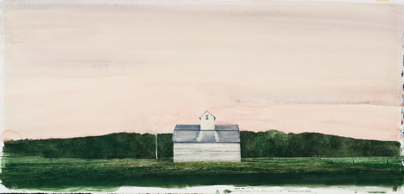 A gray barn in center of dark green farm land. The sky is a wash of grays and pinks.