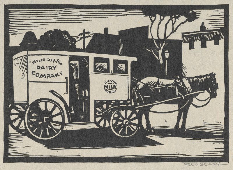 Black and white print of a milkman in a horse-drawn “Dairy Company” milk cart, surrounded by buildings, trees and telephone pole.