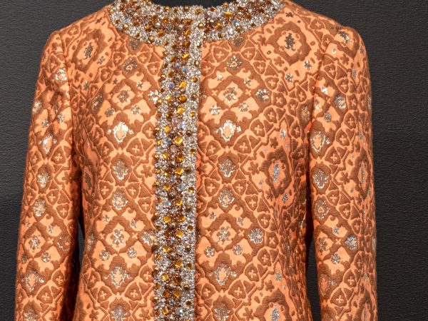 Photo of an orange, brown and gold brocade cocktail dress with beads