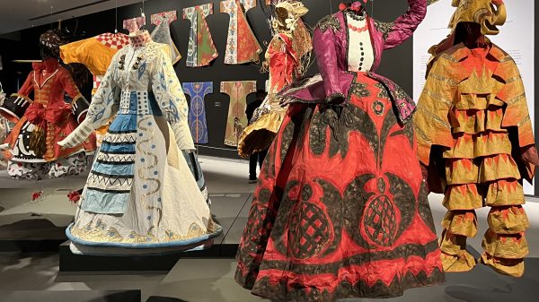 Museum galleries installed with life-size paper fashions by artist Isabelle de Borchgrave