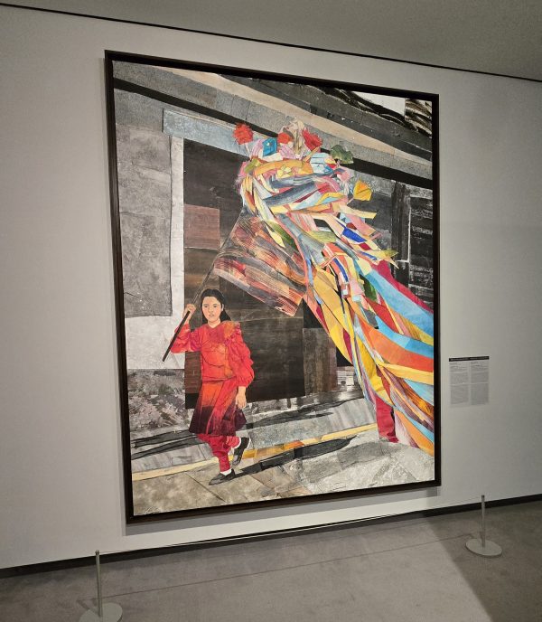 alt=Artwork: María Berrío’s Songlines, woman with dark hair, red outfit, holding rainbow colored-streamers, waving them behind her