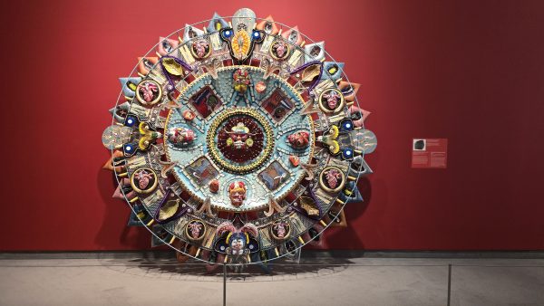 alt= Artwork: Einar and Jamex de la Torre, Oxymodern (Aztec Calendar), 2002. Blown-glass, mixed-media, aluminum with resin castings. Courtesy of the Cheech Marin Collection and Riverside Art Museum