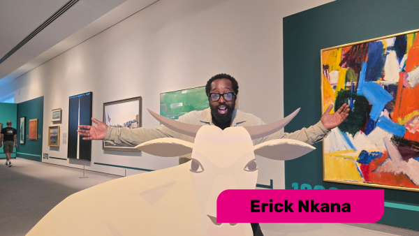 alt= Erick Nkana posing in front of an 